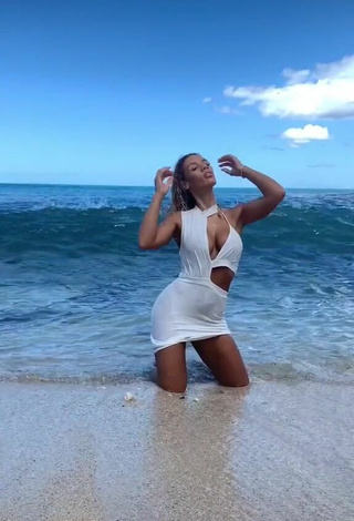 Sexy Jena Shows Cleavage in White Dress at the Beach