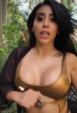 5. Beautiful Kim Shantal Shows Cleavage in Sexy Golden Swimsuit
