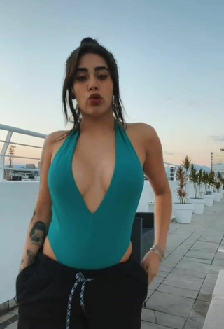 Hot Kim Shantal Shows Cleavage in Green Swimsuit