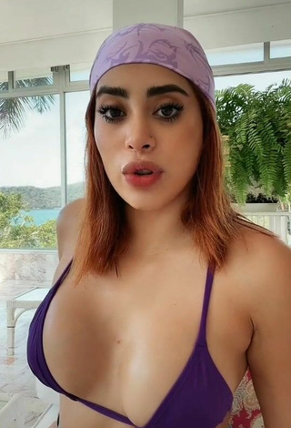 Beautiful Kim Shantal Shows Cleavage in Sexy Violet Bikini Top