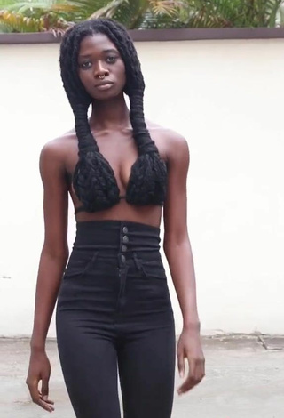 5. Sexy Laetitia Ky Shows Cleavage in Black Bikini Top