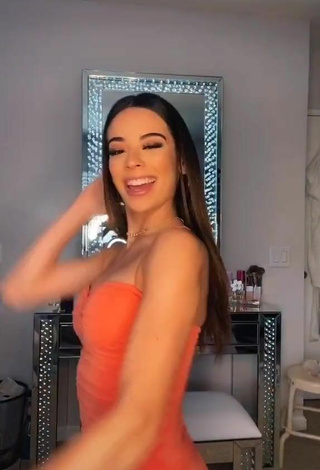 2. Hot Lauren Kettering Shows Cleavage and Bouncing Boobs in Orange Dress