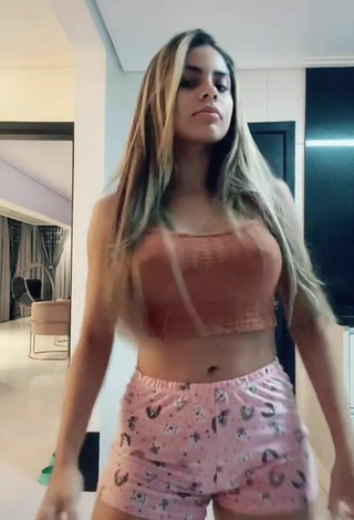 5. Sexy Lea Araujo in Orange Crop Top
