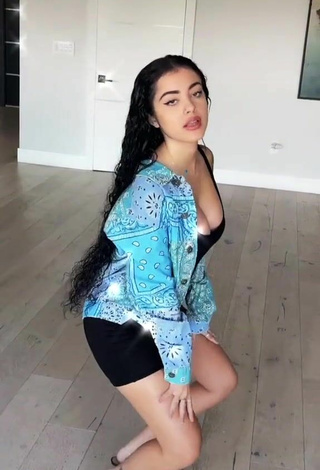 2. Sexy Malu Trevejo Shows Cleavage in Black Overall