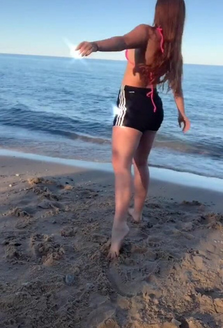 2. Elegant Mikaila Murphy in Pink Bikini Top at the Beach