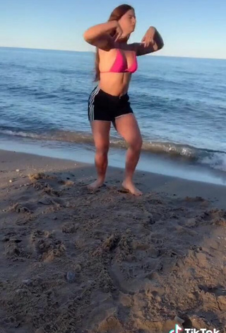 4. Elegant Mikaila Murphy in Pink Bikini Top at the Beach