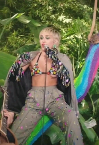 3. Sexy Miley Cyrus Shows Cleavage in Bikini Top