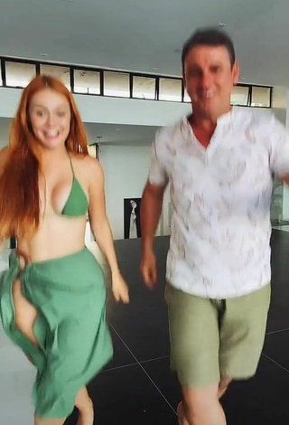 4. Seductive Mirela Janis Shows Cleavage in Green Bikini Top