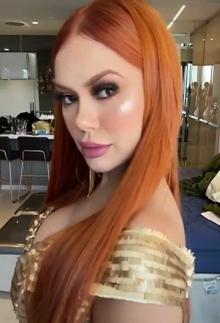 4. Hot Mirela Janis Shows Cleavage in Golden Dress