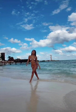 3. Cute Eva Gutowski Shows Cleavage in Bikini at the Beach