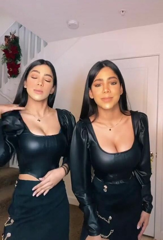 1. Sexy Melanie & Meila Shows Cleavage in Black Bodysuit
