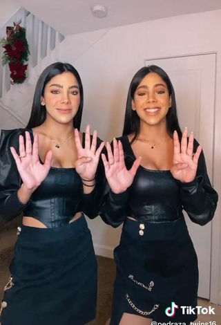 3. Sexy Melanie & Meila Shows Cleavage in Black Bodysuit