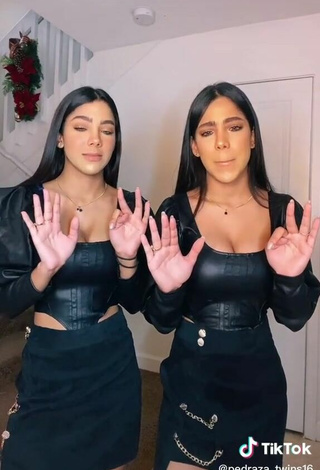4. Sexy Melanie & Meila Shows Cleavage in Black Bodysuit