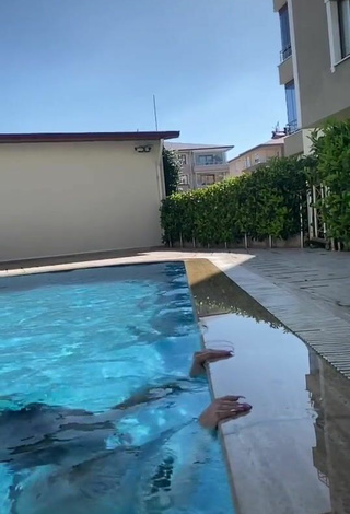 1. Sexy Özgür Balakar in Black Bikini in the Swimming Pool