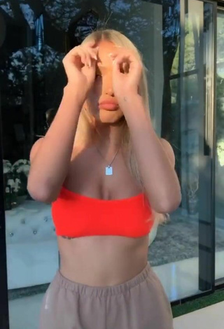 2. Beautiful Abby Rao Shows Cleavage in Sexy Orange Bikini Top