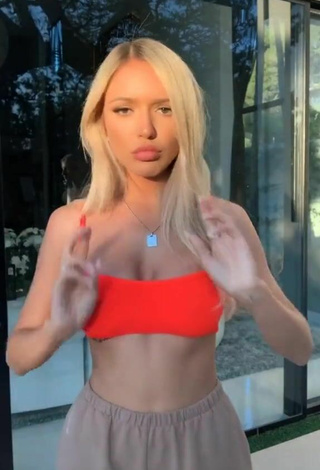 3. Beautiful Abby Rao Shows Cleavage in Sexy Orange Bikini Top