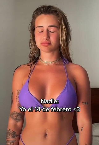 Erotic Abril Cols Shows Cleavage in Purple Bikini
