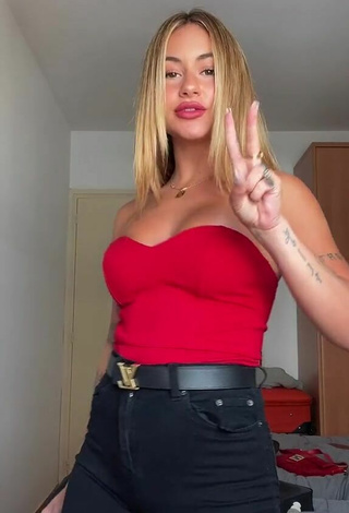 2. Sexy Abril Cols Shows Cleavage in Red Top