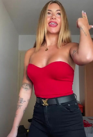 3. Sexy Abril Cols Shows Cleavage in Red Top
