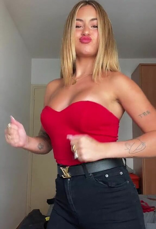 4. Sexy Abril Cols Shows Cleavage in Red Top