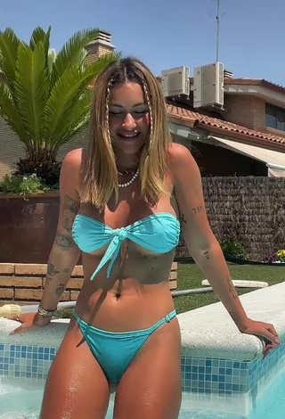 Sexy Abril Cols Shows Cleavage in Blue Bikini at the Pool