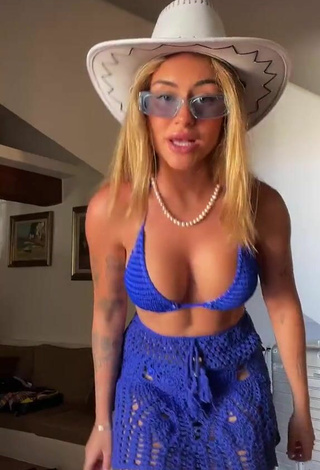 Seductive Abril Cols Shows Cleavage in Blue Bikini Top