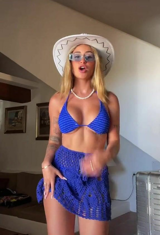 2. Seductive Abril Cols Shows Cleavage in Blue Bikini Top