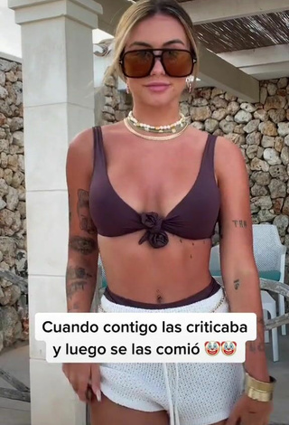Erotic Abril Cols Shows Cleavage in Brown Bikini Top