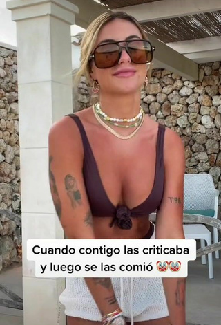2. Erotic Abril Cols Shows Cleavage in Brown Bikini Top