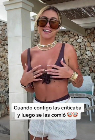 3. Erotic Abril Cols Shows Cleavage in Brown Bikini Top