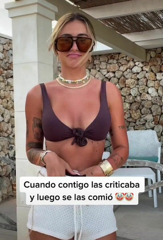 4. Erotic Abril Cols Shows Cleavage in Brown Bikini Top