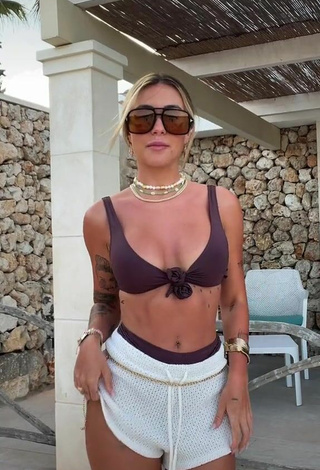 Hottie Abril Cols Shows Cleavage in Brown Bikini Top