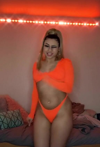 2. Erotic BbygShai in Electric Orange Bikini