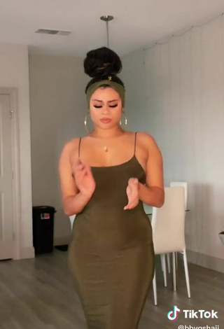 2. Sexy BbygShai in Olive Dress