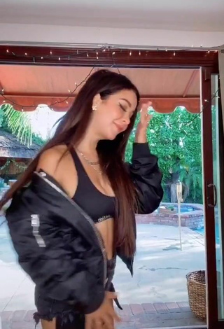 4. Sexy Caelike Shows Cleavage in Black Sport Bra