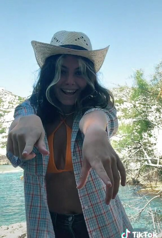 3. Cute Claudia García in Orange Bikini Top in the Sea