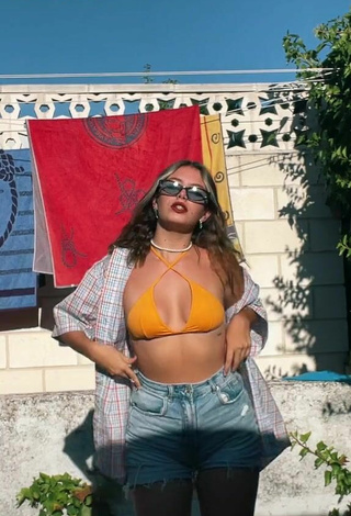 2. Sexy Claudia García in Orange Bikini Top