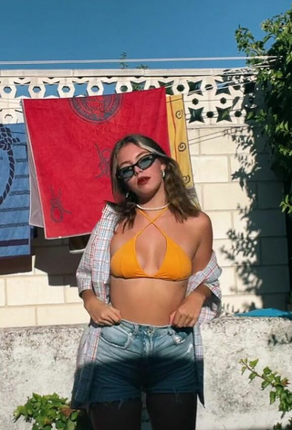 3. Sexy Claudia García in Orange Bikini Top